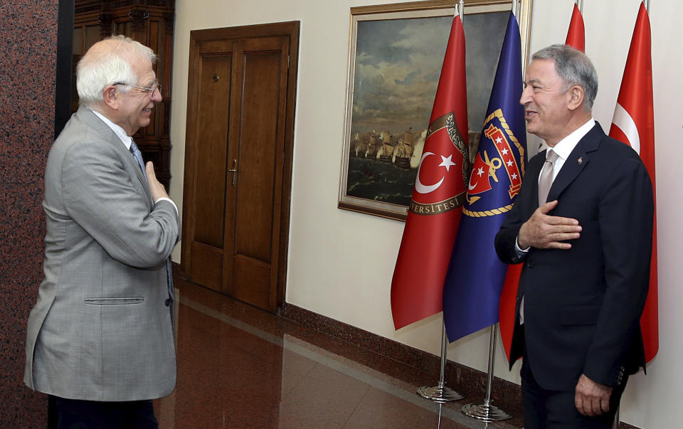 Josep Borrell Fontelles, High Representative and Vice-President of the European Commission, left, and Turkey's Defense Minister Hulusi Akar greet each other before a meeting in Ankara, Turkey, Monday, July 6, 2020. Turkey's Foreign Minister Mevlut Cavusoglu on Monday called on the European Union to be an "honest broker" in disputes between Turkey and EU member states France, Greece and Cyprus, warning that his country would be forced to "reciprocate" against any decisions the bloc takes against Ankara.(Turkish Defense Ministry via AP, Pool)