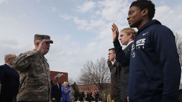 PHOTO: U.S. Army Reserve Maj. Gen. Darrell J. Guthrie administers the oath of enlistment to Future Soldiers, Ethan Ethan Fisher, center, Darrin Kuyper and Kenneth Stahl at Fort Snelling, Minn., April 29, 2022. (U.S. Army Reserve)