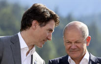 Canadian Prime Minister Justin Trudeau speaks to German Chancellor Olaf Scholz during the first day of the G7 leaders' summit, at Bavaria's Schloss Elmau castle, in Kruen, Germany, Sunday, June 26, 2022. (Lukas Barth/Pool Photo via AP)