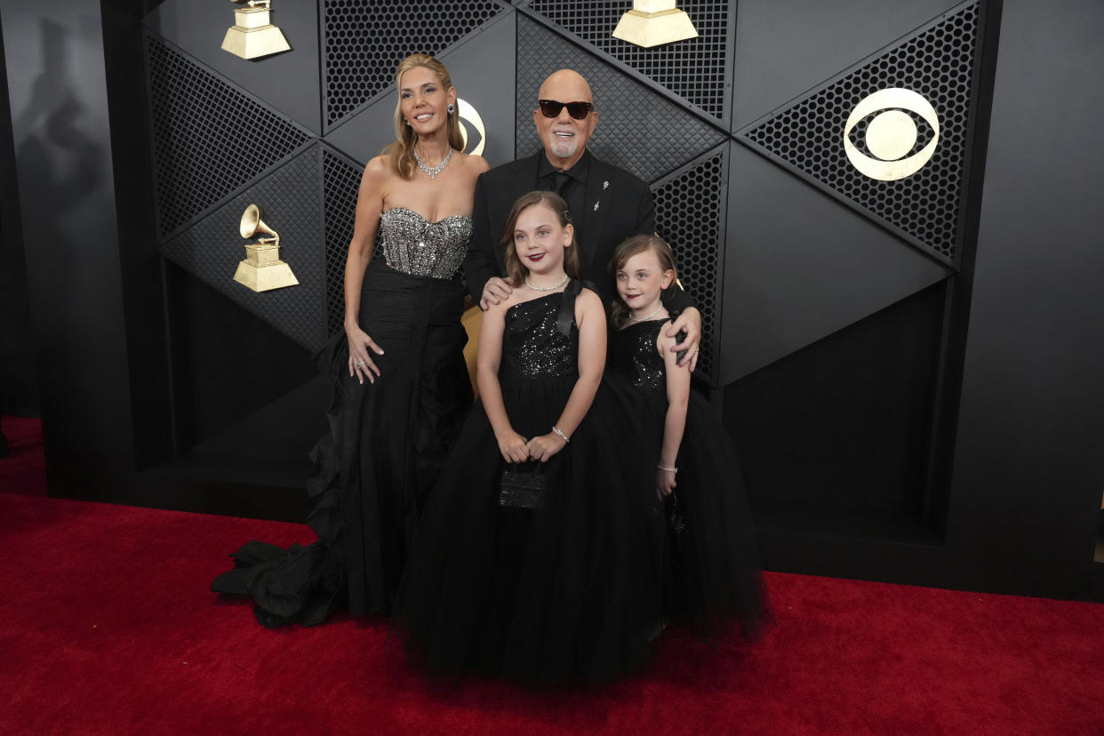 Billy Joel, Alexis Roderick, Della Rose and Remy Anne attended the 66th annual Grammy Awards on Sunday together. (Photo by Jordan Strauss/Invision/AP)