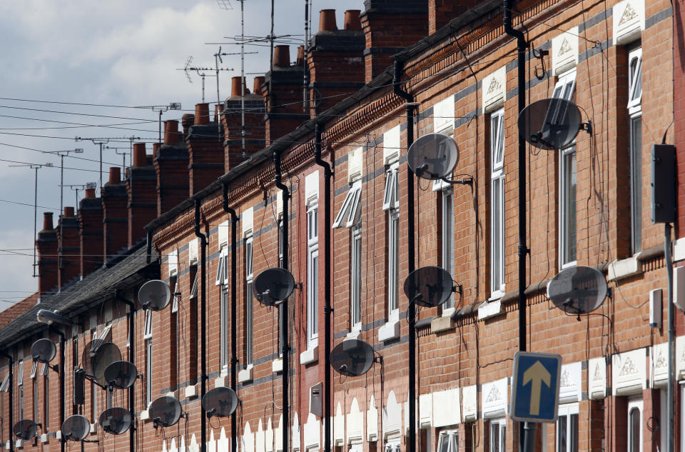 Property Satellite television dishes are seen fixed to a row of terraced houses in Leicester, central England, August 10, 2010. House prices fell last month and retail sales growth slowed abruptly according to two surveys on Tuesday that will raise concern the recovery is losing momentum.REUTERS/Darren Staples   (BRITAIN - Tags: BUSINESS)