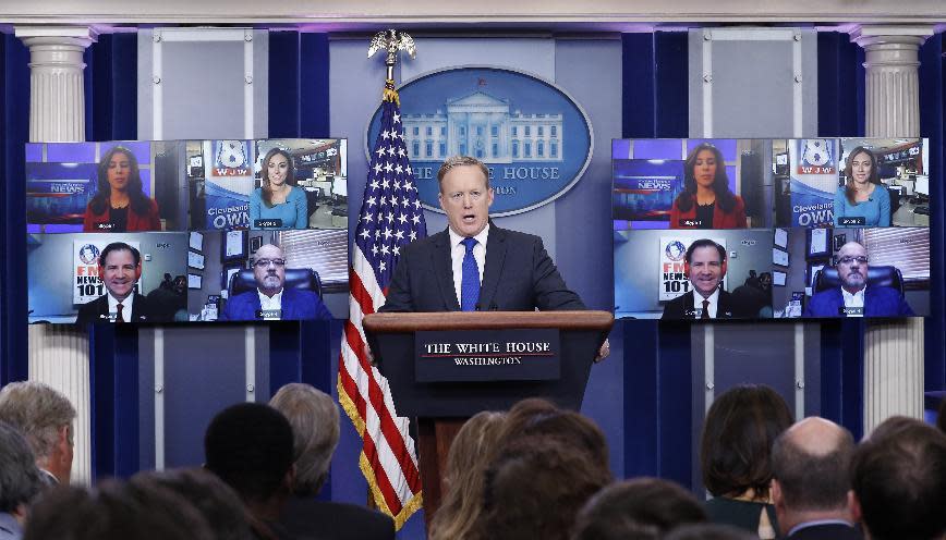 White House press secretary Sean Spicer takes a questions from reporters displayed on screens using Skype during the daily news briefing at the White House, in Washington, Wednesday, Feb. 1, 2017. (AP Photo/Carolyn Kaster)