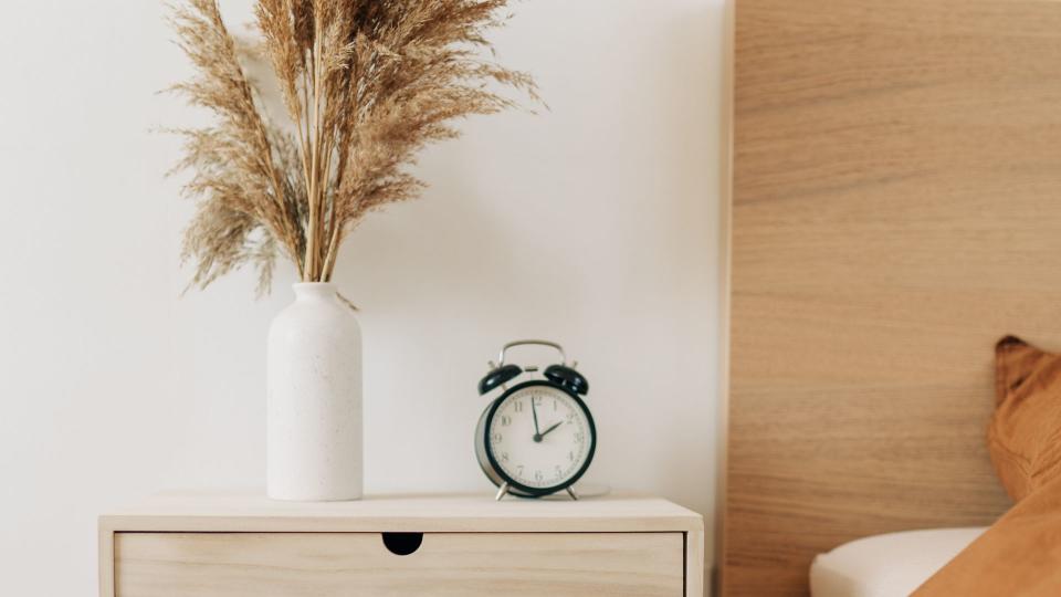 alarm clock on bedside table