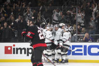 Los Angeles Kings celebrate a goal by left wing Arthur Kaliyev (34) in the second period of an NHL hockey game against the Ottawa Senators Saturday, Nov. 27, 2021, in Los Angeles. (AP Photo/Kyusung Gong)