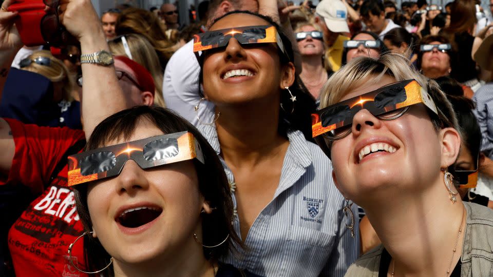 People watch the 2017 eclipse from the Empire State Building in New York. - Brendan McDermid/Reuters/File