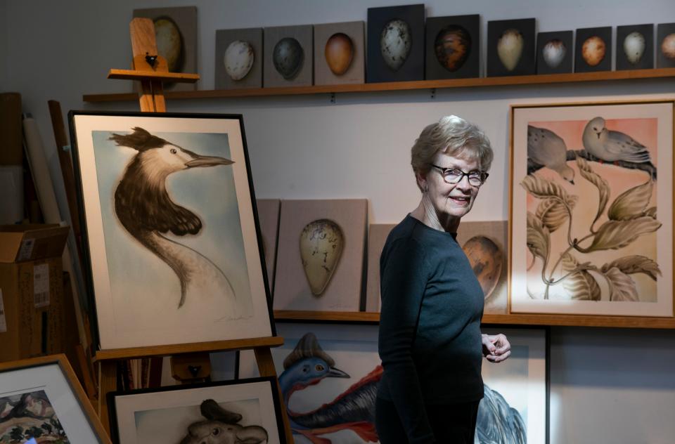 Artist Lynn Carden stand in her studio among her painted artwork at her home Buouneville. Carden will show a 60 years collection of her artwork in November at her show titled "60 Years: A Retrospective." The show will be at the Pump House Center for the Arts at Yochtangee Park in Chillicothe.