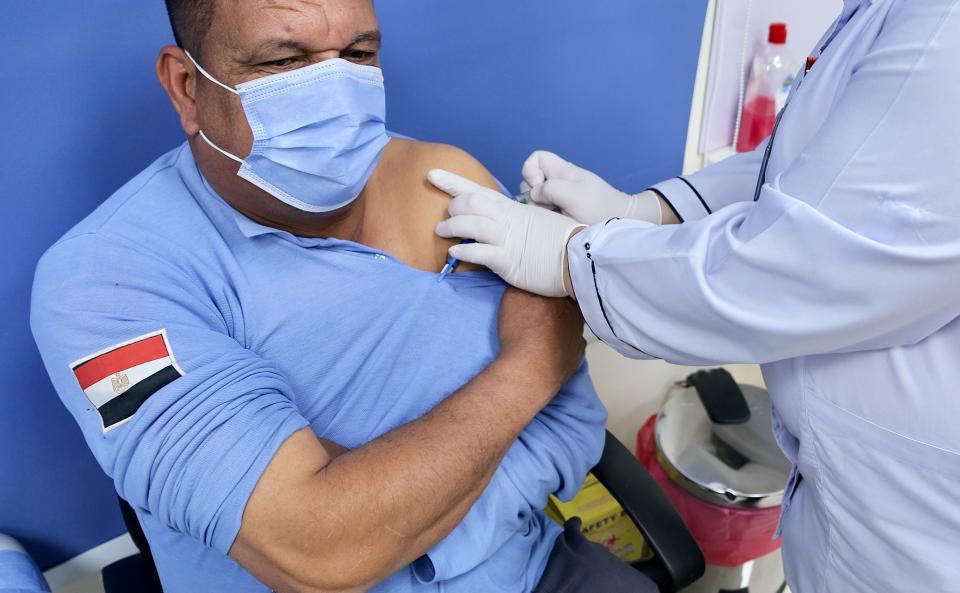 ISMAILIA EGYPT, Jan. 24, 2021 -- A medical worker receives a dose of the COVID-19 vaccine at Abu Khalifa Emergency Hospital in the northeastern province of Ismailia, Egypt, on Jan. 24, 2021. Egypt started on Sunday vaccinating medical staff with Chinese Sinopharm COVID-19 vaccine at the hospital in Ismailia, according to a vaccination program by the Egyptian Health Ministry. (Photo by Adel Eissa/Xinhua via Getty) (Xinhua/Adel Eissa via Getty Images)