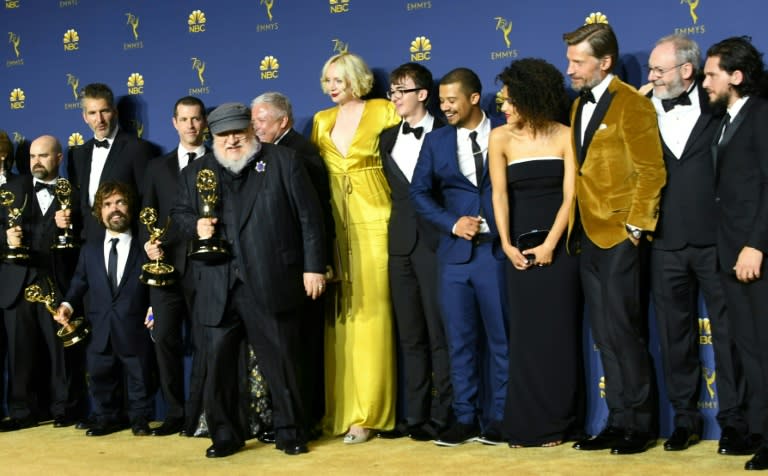 "Game of Thrones" author George RR Martin and the cast of the HBO show pose with the best drama series Emmy -- the ninth for the program this year