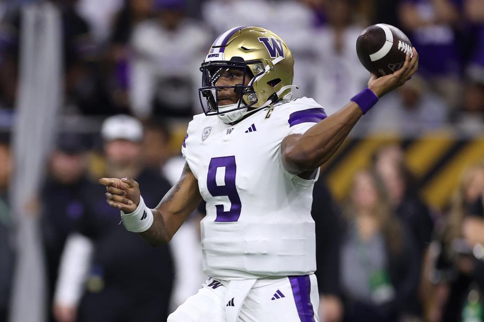 HOUSTON, TEXAS - JANUARY 08:  Michael Penix Jr. #9 of the Washington Huskies throws the ball in the first quarter against the Michigan Wolverines during the 2024 CFP National Championship game at NRG Stadium on January 08, 2024 in Houston, Texas. (Photo by Maddie Meyer/Getty Images)