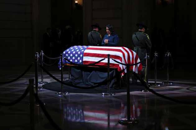 San Francisco Mayor London Breed prays over Feinstein's casket before the public viewing.