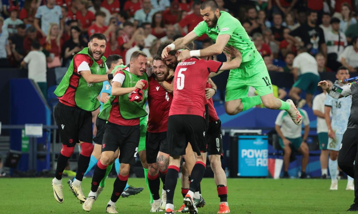 <span>Georgia celebrate their historic Euro 2024 victory against Portugal at the final whistle.</span><span>Photograph: Jean Catuffe/DPPI/Shutterstock</span>