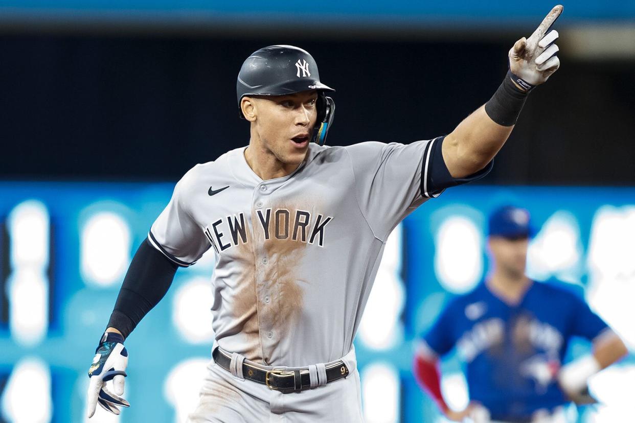 Aaron Judge #99 of the New York Yankees runs the bases as he hits his 61st home run of the season in the seventh inning against the Toronto Blue Jays at Rogers Centre on September 28, 2022 in Toronto, Ontario, Canada. Judge has now tied Roger Maris for the American League record.