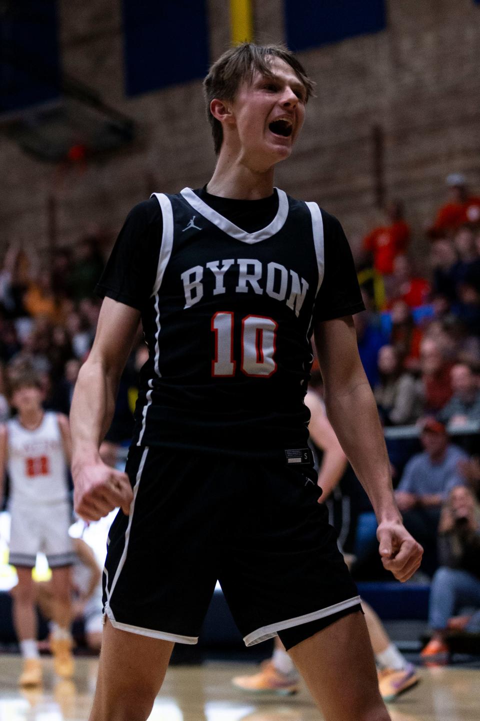 Byron's Ryan Tucker (10) yells in celebration after making a basket during a super sectionals game against Chicago Latin on March 4, 2024 at Sterling High School in Sterling, Illinois.