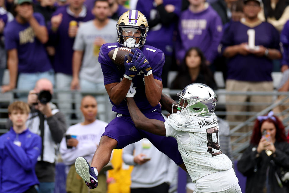 SEATTLE, WASHINGTON - OCTOBER 14: Rome Odunze #1 of the Washington Huskies catches a touchdown against Dontae Manning #8 of the Oregon Ducks during the third quarter at Husky Stadium on October 14, 2023 in Seattle, Washington. (Photo by Steph Chambers/Getty Images)
