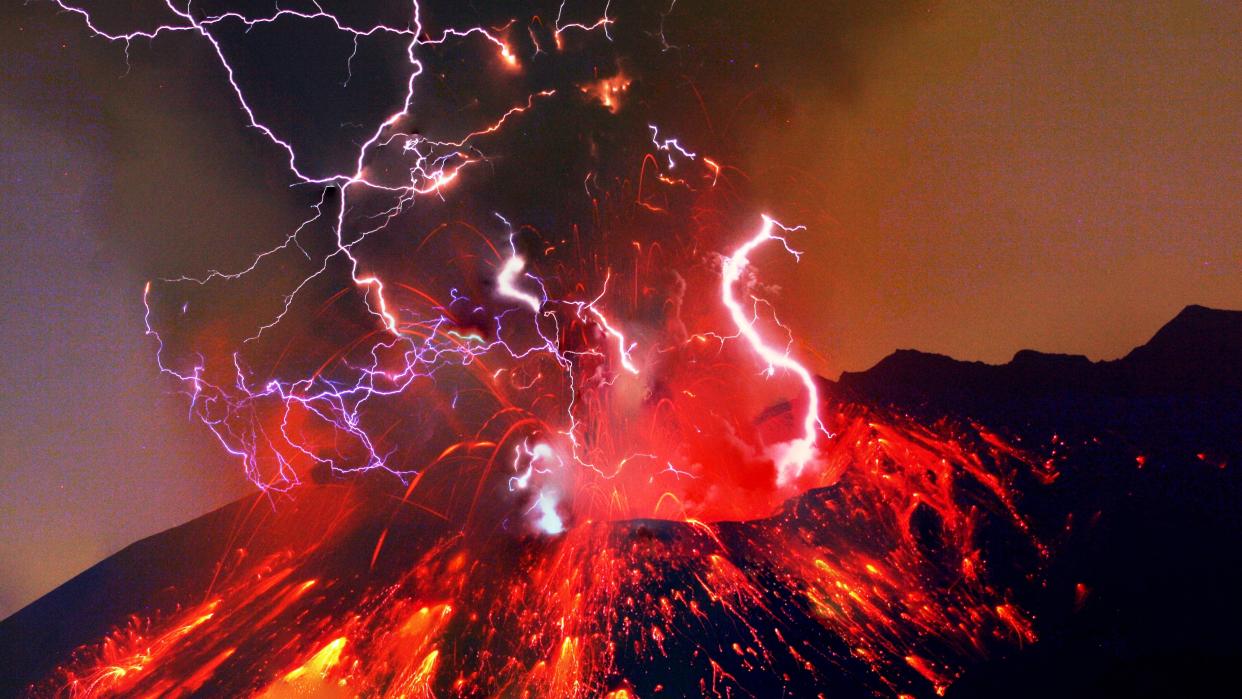  A volcano erupting with lightning strikes coming from the crater. 