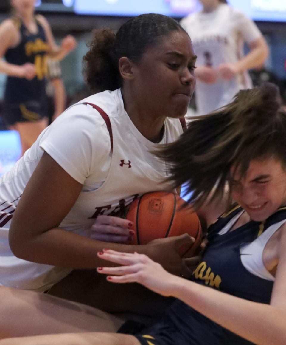 Albertus' Mikaiya Beasley, top, fights for a loose ball with Pelham's Valendena Arakas during their Class AA Girls Semifinal at the Westchester County Center Feb. 26, 2024. Albertus won 68-32.