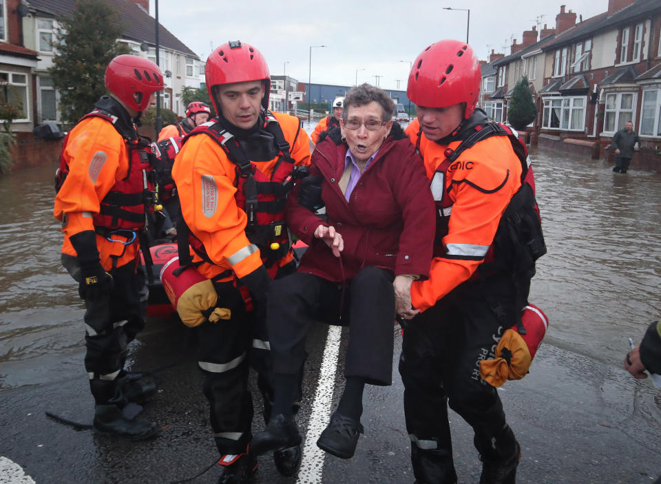 Fire and Rescue service members rescue residents trapped by floodwater in Doncaster, Yorkshire, as parts of England endured a month's worth of rain in 24 hours, with scores of people rescued or forced to evacuate their homes, others stranded overnight in a shopping centre, and travel plans thrown into chaos. PA Photo. Picture date: Friday November 8, 2019. See PA story WEATHER Rain. Photo credit should read: Danny Lawson/PA Wire