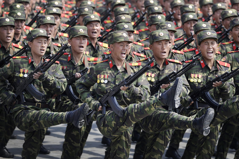 <p>Soldiers goose-step across Kim Il Sung Square in Pyongyang, North Korea, during a parade to celebrate the 105th birth anniversary of Kim Il Sung, the country’s late founder and grandfather of current ruler Kim Jong Un on April 15, 2017. The message of the parade is clear: North Korea is, or is near to being, able to launch a pre-emptive strike against a regional target. It is preparing to withstand a retaliatory follow-up attack if it does, and it is building the arsenal it needs to then launch a second wave of strikes, this time at the U.S. mainland. (Photo: Wong Maye-E/AP) </p>