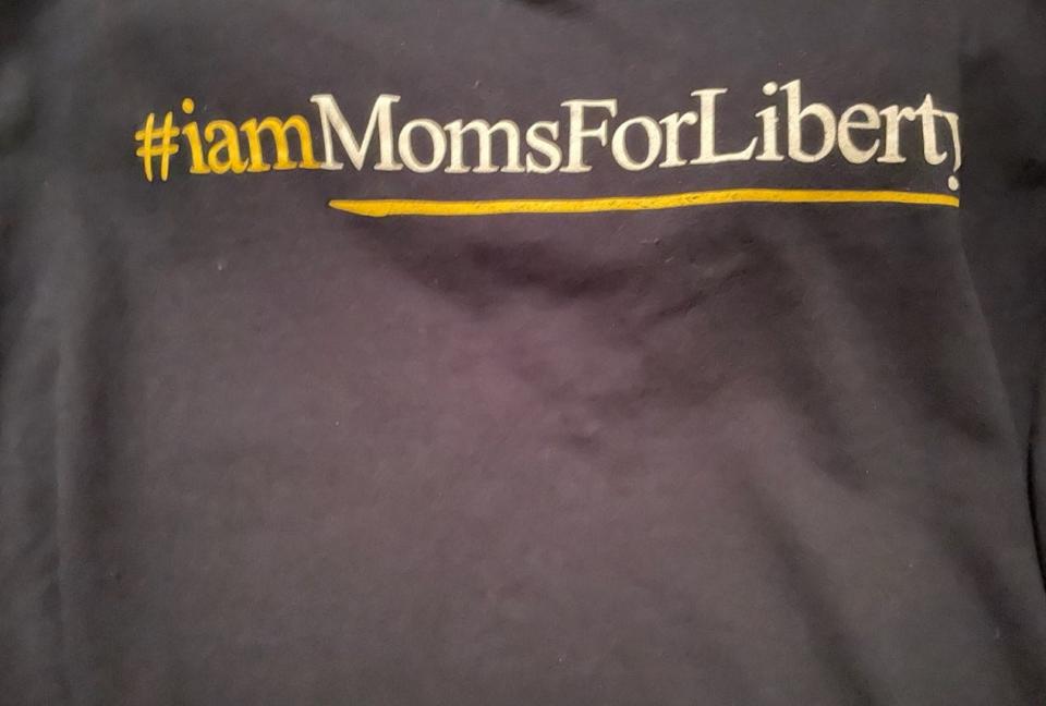 Mirna Eads wore a Moms for Liberty T-shirt while working at a poll location Tuesday.