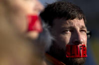 A member of "Bound 4 Life" protests outside the Supreme Court .