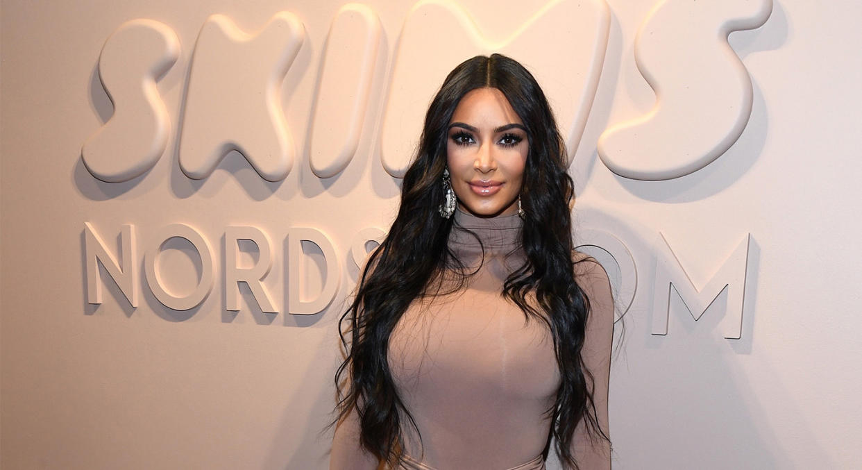 Kim Kardashian in front of SKIMS sign. (Getty Images)