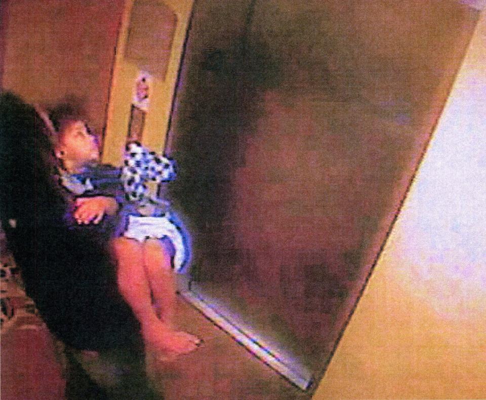 This surveillance image from a Sanford hotel shows Mario McNeill carrying 5-year-old Shaniya Davis on Nov. 10, 2009. The girl's body was found a week later a few miles from the hotel. She'd been taken from her Fayetteville home and killed in Sanford within hours of her abduction. McNeil was convicted and sentenced to death.