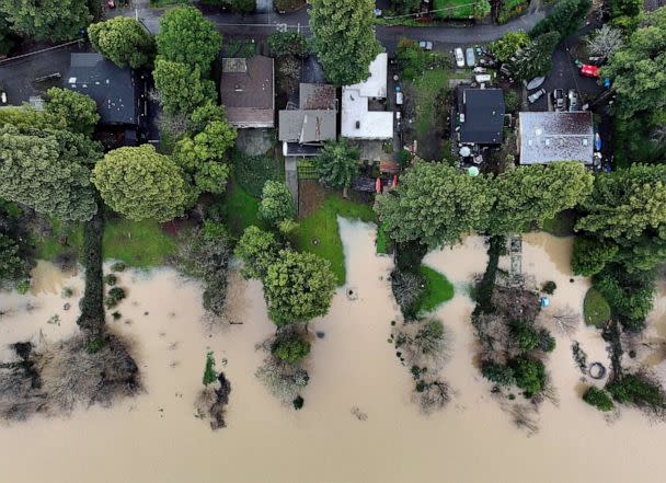 PHOTO: Floodwater from the Russian River approaches homes following a chain of winter storms, Jan. 15, 2023 in Guerneville, Calif. (Fred Greaves/Reuters)