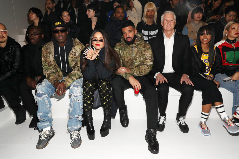 NEW YORK, NEW YORK - FEBRUARY 05:(L - R) Edward Enninful, Virgil Abloh, Rosalia, Drake, John Donahoe and Gabby Douglas attend the 2020 Tokyo Olympic collection fashion show at The Shed on February 05, 2020 in New York City. (Photo by Bennett Raglin/Getty Images)