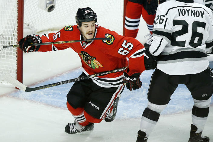 Chicago Blackhawks center Andrew Shaw (65) celebrates after teammate Brent Seabrook scored a goal against the Los Angeles Kings during the first period in Game 5 of the Western Conference finals in the NHL hockey Stanley Cup playoffs on Wednesday, May 28, 2014, in Chicago. The Blackhawks won 5-4 in the second overtime. (AP Photo/Andrew A. Nelles)