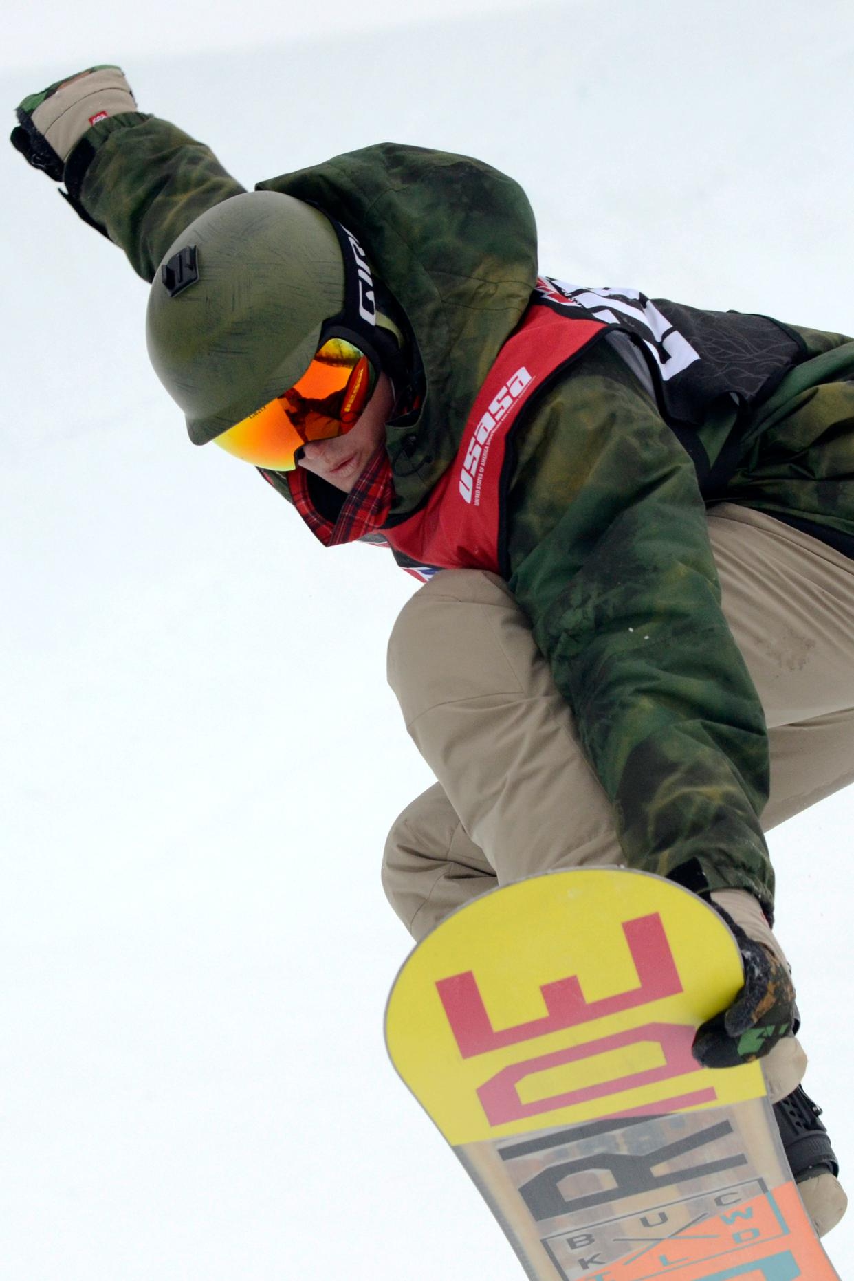 A snowboarder competes in a halfpipe competition at The Highlands near Harbor Springs.