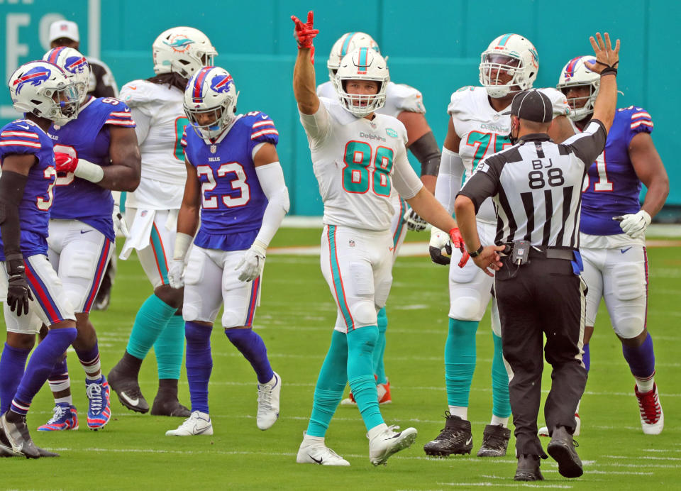 Miami Dolphins tight end Mike Gesicki (88) signals a first down on a pass reception in the first quarter against the Buffalo Bills on Sunday, September 20, 2020 at Hard Rock Stadium in Miami Gardens, Florida. (Charles Trainor Jr./Miami Herald/Tribune News Service via Getty Images)