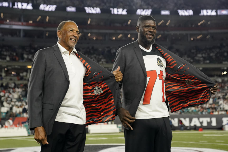 Former Cincinnati Bengals' Isaac Curtis and Willie Anderson were inducted into the Ring of Honor during the halftime of an NFL football game between the Cincinnati Bengals and the Miami Dolphins, Thursday, Sept. 29, 2022, in Cincinnati. (AP Photo/Joshua A. Bickel)