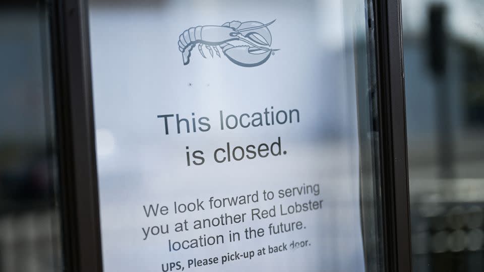 A "location closed" sign hangs in the window of a closed Red Lobster restaurant in Torrance, California, in May of 2024. - Patrick T. Fallon/AFP/Getty Images