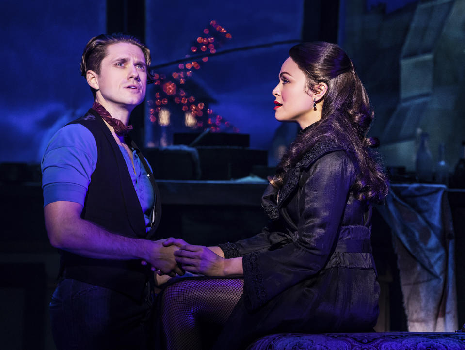 This image released by Boneau/Bryan-Brown shows Aaron Tveit, left, and Karen Olivo during a performance of the musical "Moulin Rouge!" Tveit and Olivo received Tony nominations for their roles in the production, which also garnered a nomination for best musical. (Matthew Murphy/Boneau/Bryan-Brown via AP)