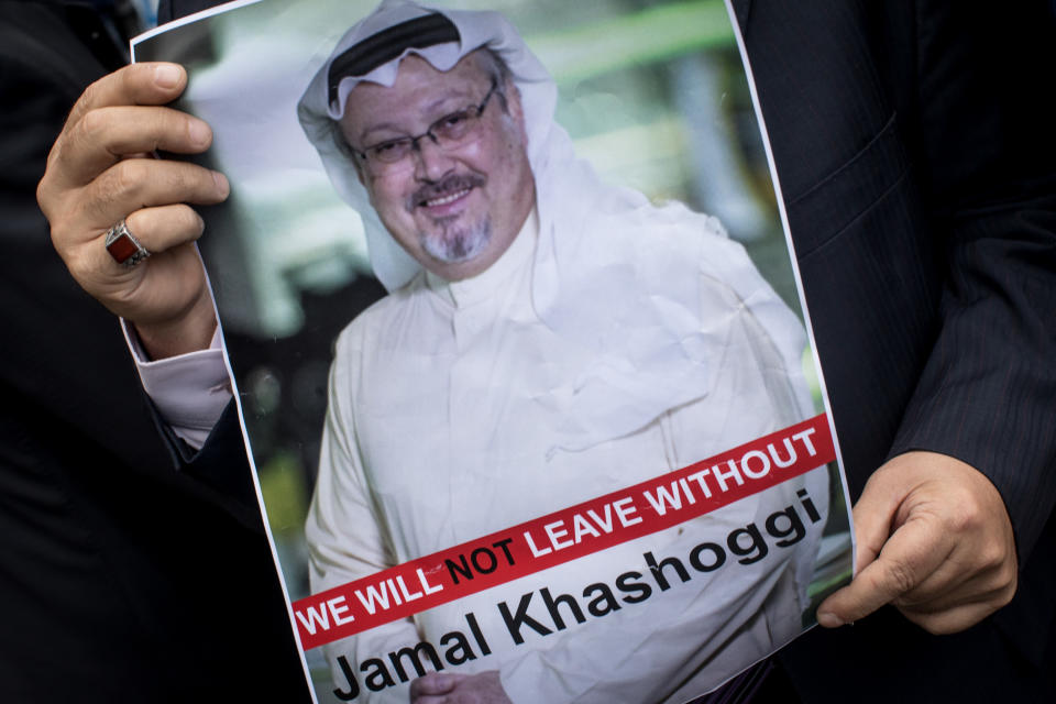 A man holds a poster of Saudi journalist Jamal Khashoggi