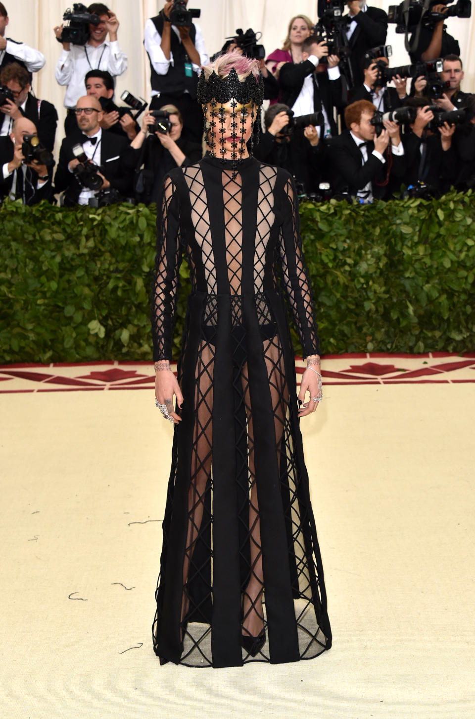 <p>Despite hardly being able to recognise her behind the thin veil, that is in fact Cara Delevingne wearing Diane von Furstenberg at the Met Gala Photo: Getty Images </p>