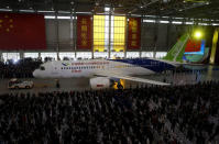 FILE PHOTO: The first C919 passenger jet made by the Commercial Aircraft Corp of China (Comac) is pulled out during a news conference at the company's factory in Shanghai, November 2, 2015. REUTERS/Stringer/File Photo