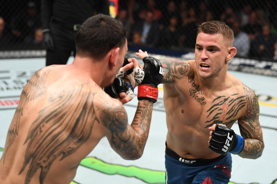 ATLANTA, GA - APRIL 13:  (R-L) Dustin Poirier punches Max Holloway in their interim lightweight championship bout during the UFC 236 event at State Farm Arena on April 13, 2019 in Atlanta, Georgia. (Photo by Josh Hedges/Zuffa LLC/Zuffa LLC via Getty Images)