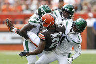 Cleveland Browns wide receiver Amari Cooper (2) is upended by New York Jets cornerback Sauce Gardner (1), linebacker Quincy Williams (56), and safety Jordan Whitehead (3) after making a catch during the first half of an NFL football game, Sunday, Sept. 18, 2022, in Cleveland. (AP Photo/Ron Schwane)