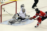 NEWARK, NJ - JUNE 09: Jonathan Quick #32 of the Los Angeles Kings makes a save in front of Travis Zajac #19 of the New Jersey Devils during Game Five of the 2012 NHL Stanley Cup Final at the Prudential Center on June 9, 2012 in Newark, New Jersey. (Photo by Jim McIsaac/Getty Images)