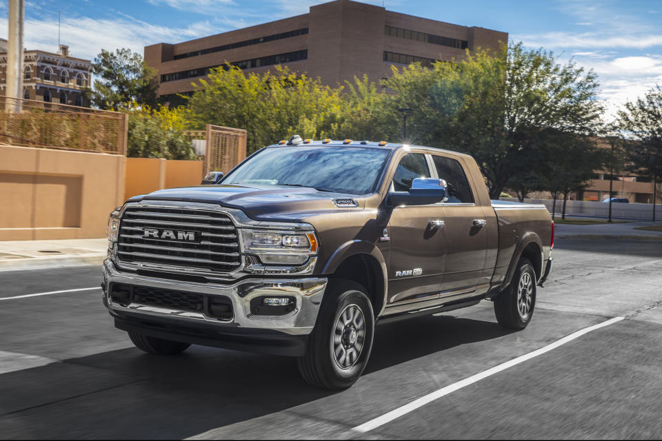 This undated photo provided by Ram shows the redesigned 2019 Ram 2500. Ram redesigned its heavy-duty lineup for 2019 with new styling, upgraded interiors, and a wide range of engine and transmission choices. As with its light-duty 1500 sibling, the Ram 2500's ace card is a unique rear coil-spring suspension that creates a more comfortable ride than its competitors. (AJ Mueller/FCA US via AP)