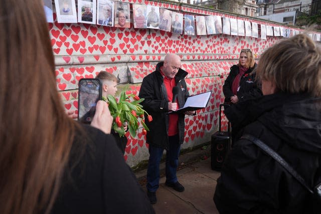 People take part in the memorial service 