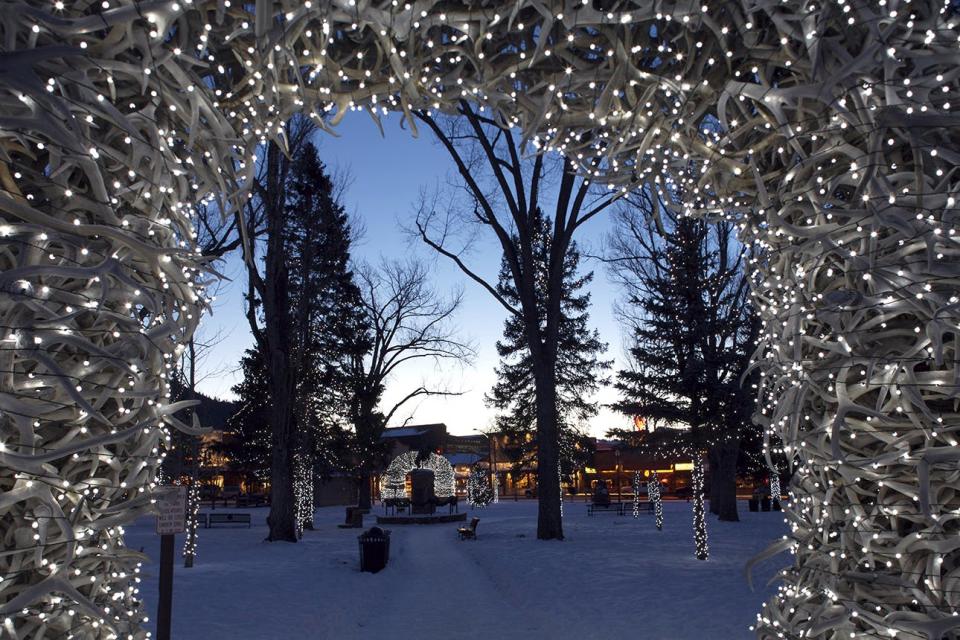 Christmas lights adorn antler arches in Jackson Wyomings city center.