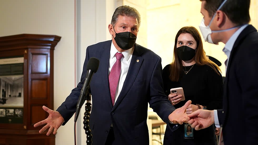 Sen. Joe Manchin (D-W.Va.) speaks to reporters after hearing from President Biden at a Democratic caucus luncheon at the Senate Russell Office building to discuss voting rights and filibuster reform on Thursday, January 13, 2022.