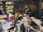 Rubble from a destroyed building at the scene of an airstrike in Mekele, in the Tigray region of northern Ethiopia Thursday, Oct. 28, 2021. An Ethiopian government spokesman says a new airstrike has hit Mekele, targeting a site used by rival Tigray forces to make and repair weapons, while a Tigray spokesman instead says it struck a "civilian residence" killing six people and wounding more than 20. (AP Photo)