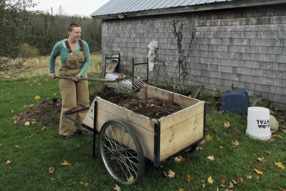 In this September 2013 photo released by Sterling College, student Melissa Eckstrom, of Philadelphia, turns earth for better planting on the Sterling College farm in Craftsbury, Vt. At Sterling and six other schools across the country are required to work as part of their education, which gives them a discount on their tuition, and some leave school debt-free. (AP Photo/Sterling College, Christian Feuerstein)