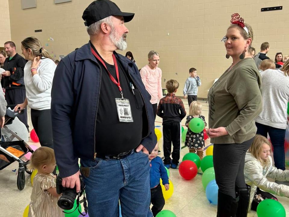 Covering local community events is routine for small town newspaper editors such as Chris Umscheid, shown here at December’s Noon Year’s Eve sponsored by the Solon Public Library