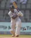 India's Mayank Agarwal plays shot during the day two of their second test cricket match with New Zealand in Mumbai, India, Saturday, Dec. 4, 2021.(AP Photo/Rafiq Maqbool)