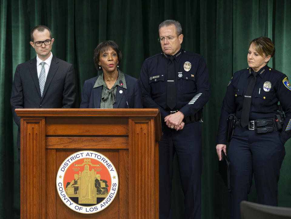 Los Angeles County District Attorney Jackie Lacey, at podium, announces that film producer Harvey Weinstein has been charged with raping a woman and sexually assaulting another in separate incidents over a two-day period in 2013, at a news conference at the Hall of Justice in Los Angeles, Monday, Jan. 6, 2020. From left, Paul Thompson, Los Angeles County District Deputy Attorney, Lacey, Michel Moore, Chief of the Los Angeles Police Department, and Sandra Spagnoli, Chief of Police, Beverly Hills, Calif. (AP Photo/Damian Dovarganes)