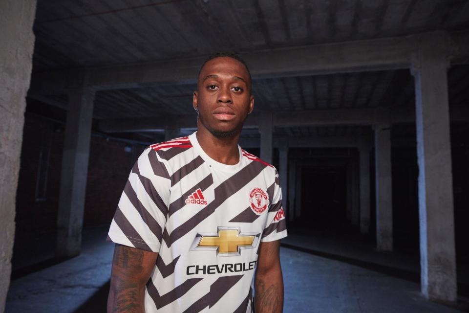 Aaron Wan-Bissaka models Manchester United's new third kit Photo: Adidas / Manchester United